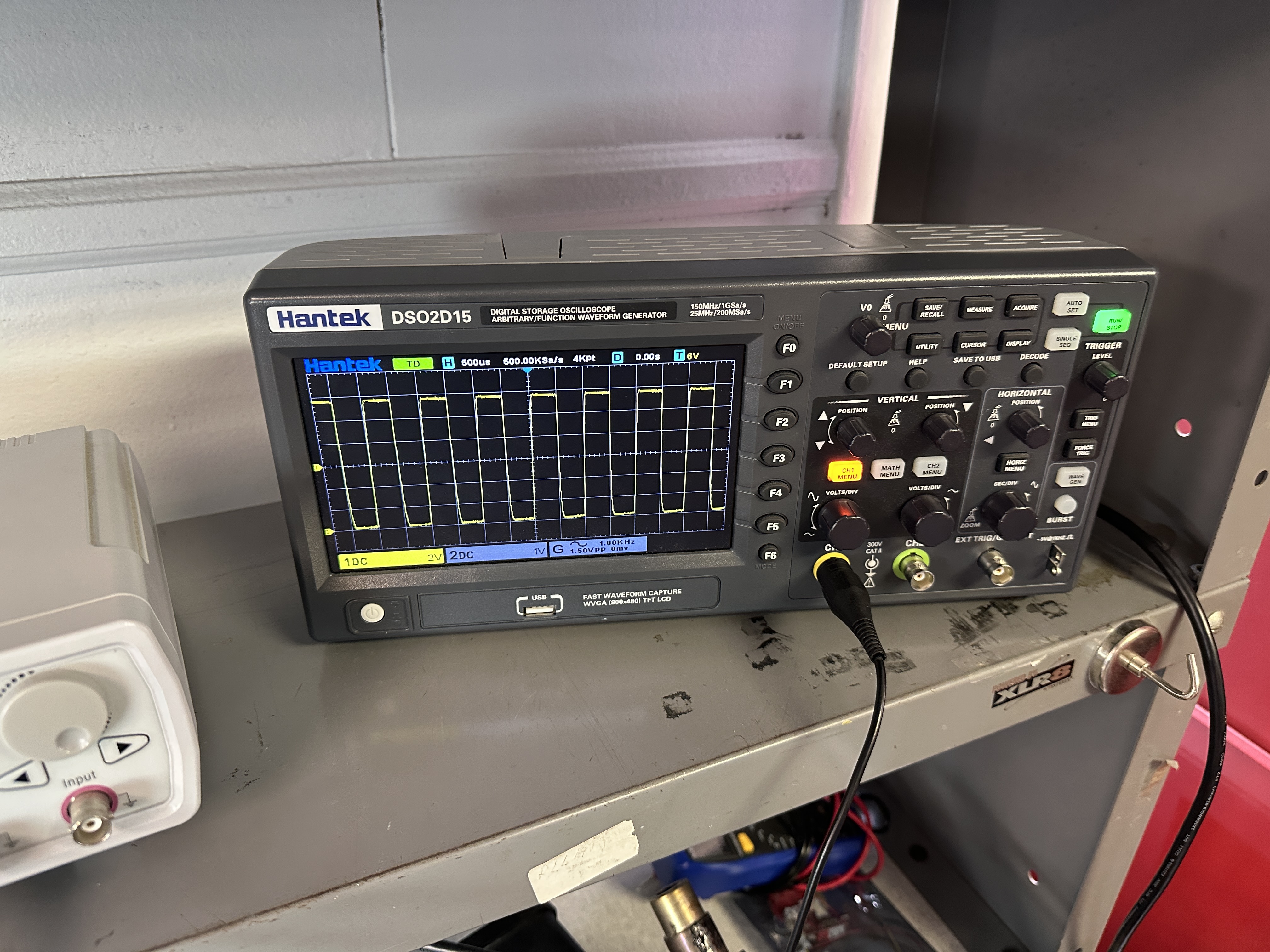 Scope capture: 1 kHz square wave on the output stage of the driver